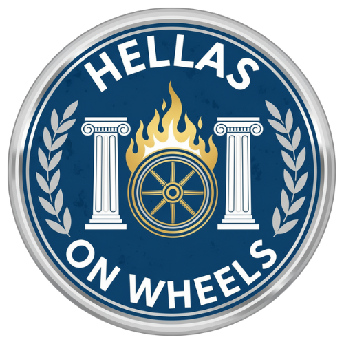 Hellas on Wheels logo featuring a flaming blue and gold chariot wheel between two white Greek pillars inside a silver metallic circular border.